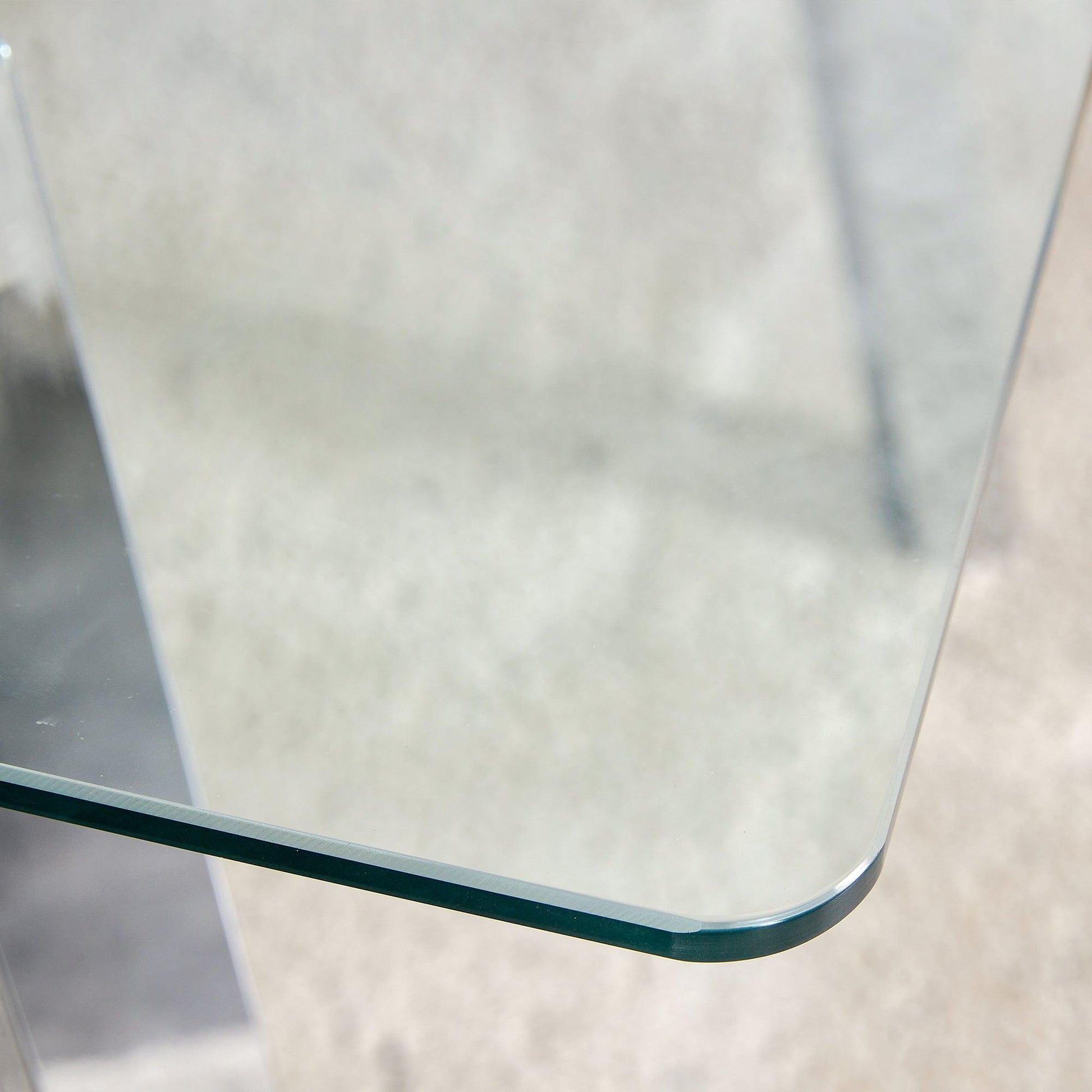 A modern minimalist rectangular glass dining table with tempered glass tabletop and silver metal legs - FurniFindUSA